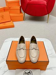 Hermès Paris loafers in mastic beige goatskin with a palladium-plated signature 