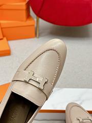 Hermès Paris loafers in mastic beige goatskin with a palladium-plated signature 