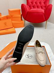 Hermès Paris loafers in mastic beige goatskin with a palladium-plated signature 